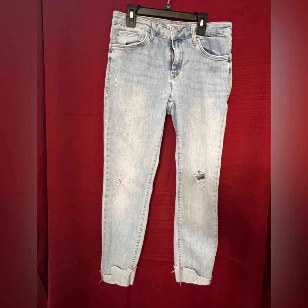 Cropped, distressed Mavi Jeans with cuffed hem.